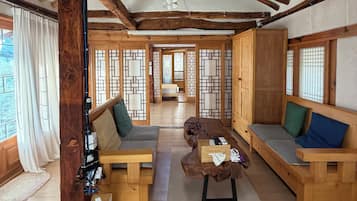 Deluxe House, Kitchen, Garden View | Living area | TV