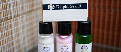 A box labeled 'Delphi Grand' soap and three bottles of hair care products.