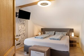 2 dormitorios, tabla de planchar con plancha, wifi gratis y ropa de cama