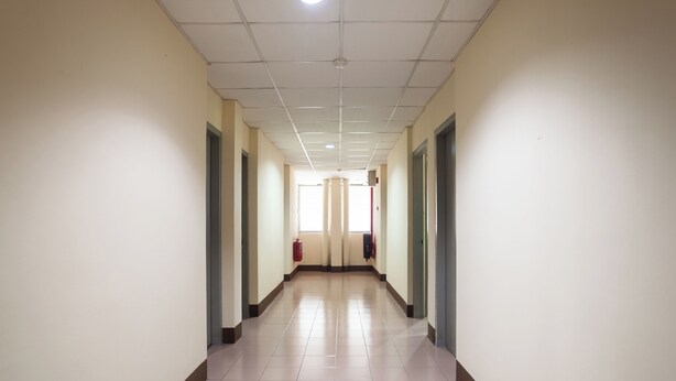 A long, narrow hallway with white walls and a tiled floor. - Hotel O Melintang Hotel (Hutan Melintang)