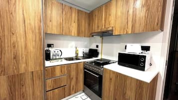 Fridge, stovetop, cookware/dishes/utensils, dining tables