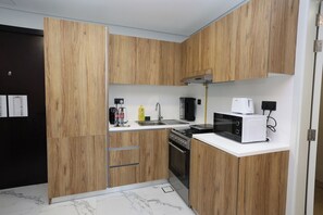 Fridge, stovetop, cookware/dishes/utensils, dining tables