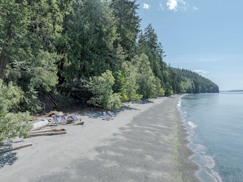 West Beach Cottage includes a private stretch of beach with views of Waldron Island and beyond.