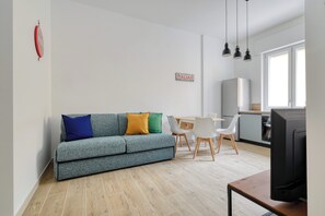 Comfort Apartment, City View | Living area | 27-inch LED TV with digital channels