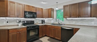 Cozy 2-Bedroom Retreat with Wooded Views, Fire Pit & Stylish Kitchen!