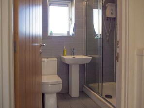 Shower, hair dryer, towels, toilet paper