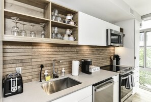 High chair, cookware/dishes/utensils, ice maker, paper towels