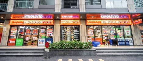 A KINGFOODmart store with multiple entrances and visible promotional signs.
