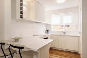 Coffee/tea maker, fridge, microwave, oven