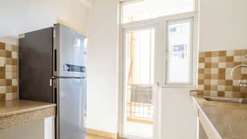 Studio, City View | Private kitchen | Fridge, microwave, oven, dishwasher