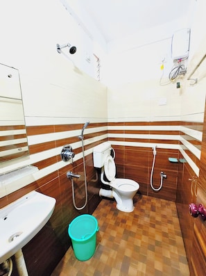 Shower, free toiletries, slippers, soap