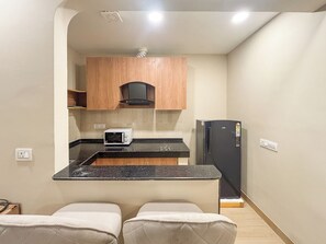 Studio, City View | Private kitchenette | Fridge, microwave, oven, dishwasher