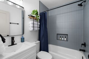 Shower, hair dryer, towels, shampoo