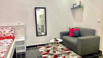 Superior Apartment, City View | Living area | Flat-screen TV, printers