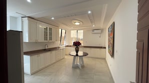 Family Apartment, Balcony, City View | Private kitchen | Full-size fridge, microwave, oven, stovetop - MARCY SUITES BASTOS (Yaounde)