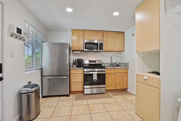 Fridge, stovetop, coffee/tea maker, cookware/dishes/utensils