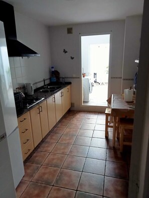 Fridge, oven, coffee/tea maker, cookware/dishes/utensils