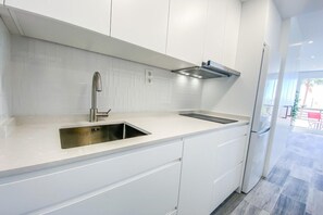Fridge, microwave, stovetop, coffee/tea maker