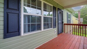 A house with a porch, large windows, and a door. - Commuter-friendly Home: 3 Mi to Dtwn Knoxville! (Knoxville)