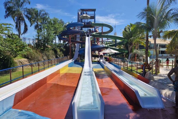 A water park with multiple slides and a central water feature.
