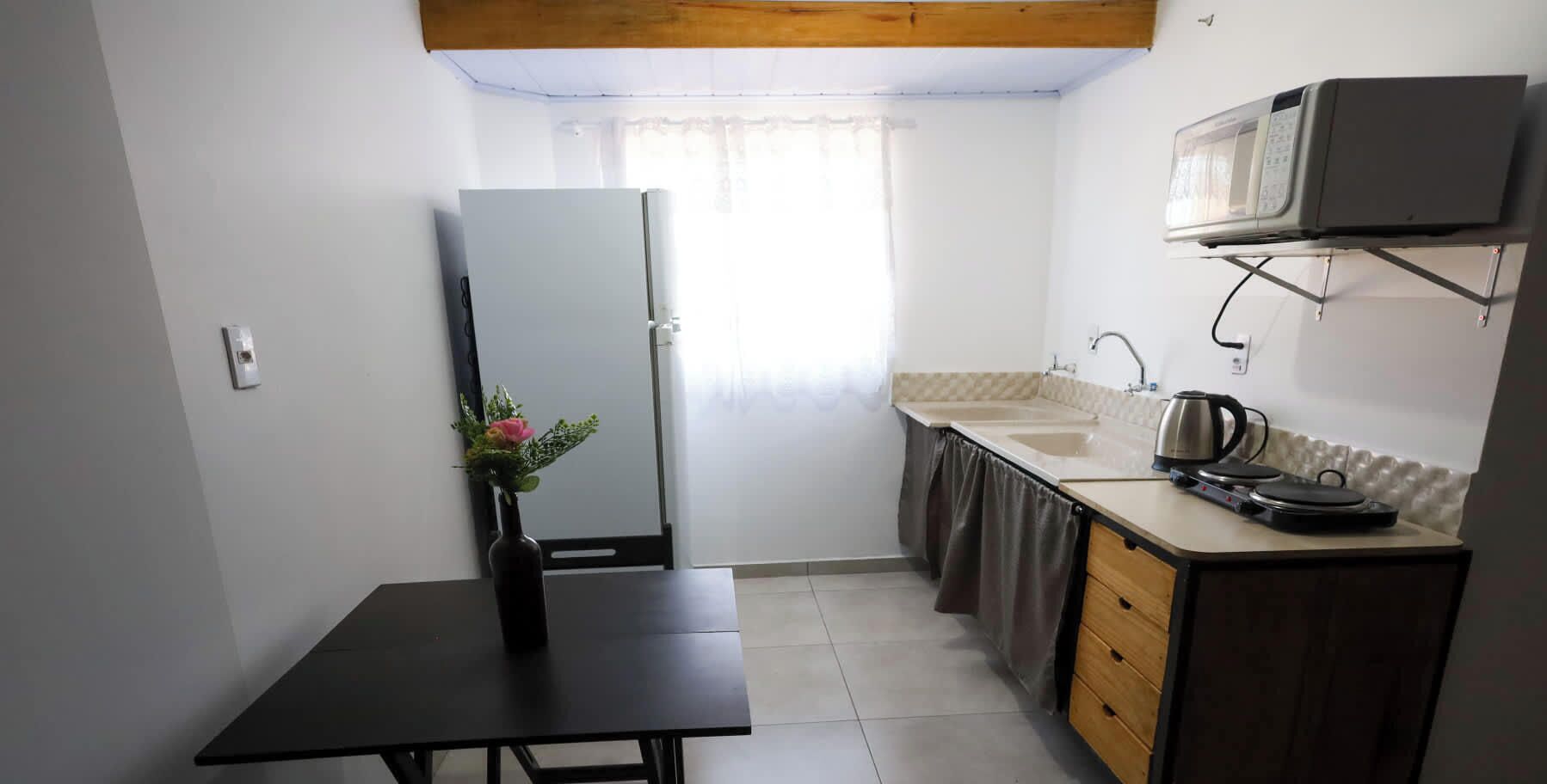 Fridge, microwave, stovetop, cookware/dishes/utensils