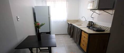 Fridge, microwave, stovetop, cookware/dishes/utensils