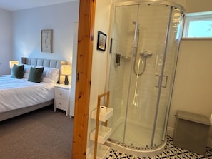 Shower, hair dryer, towels, toilet paper