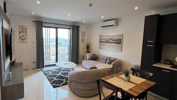 Apartamento luxo, 1 quarto, vista para a cidade | Área de estar