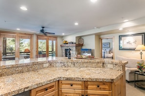 A kitchen with granite countertops, wooden cabinets, and a ceiling fan. - Trail's End Lodge at Deer Valley Resort - One Bedroom Residence with Spa #204 1 Condo (Park City)