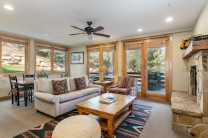 A spacious living room with a sofa, coffee table, and a fireplace. - Trail's End Lodge at Deer Valley Resort - One Bedroom Residence with Spa #204 1 Condo (Park City)