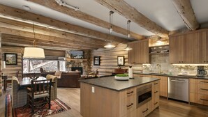 A log cabin interior with a dining area, kitchen, and living space. - Pine Inn 9 - Two Bedroom Condo with Spa Trail's End Lodge by Deer Valley Resort (Park City)