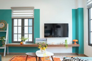 Executive Villa, Garden View | Living area | Flat-screen TV