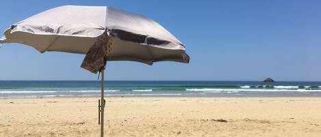 On the beach, sun loungers, beach towels