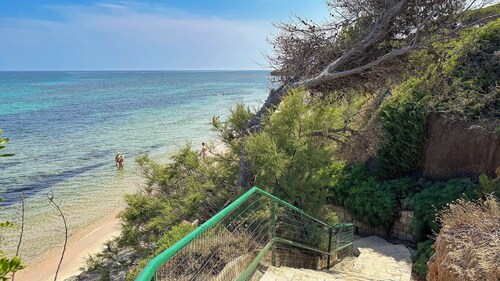 Villa  Siro Is Morus a few steps from the sea surrounded by greenery