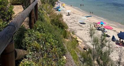 Villa Siro Is Morus a few steps from the sea surrounded by greenery