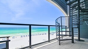 A balcony with a view of the beach and ocean. - Henderson Beach Villa #2 (Destin)