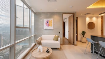 Elite Apartment, City View | Living area | 50-inch Smart TV with digital channels, Netflix, streaming services