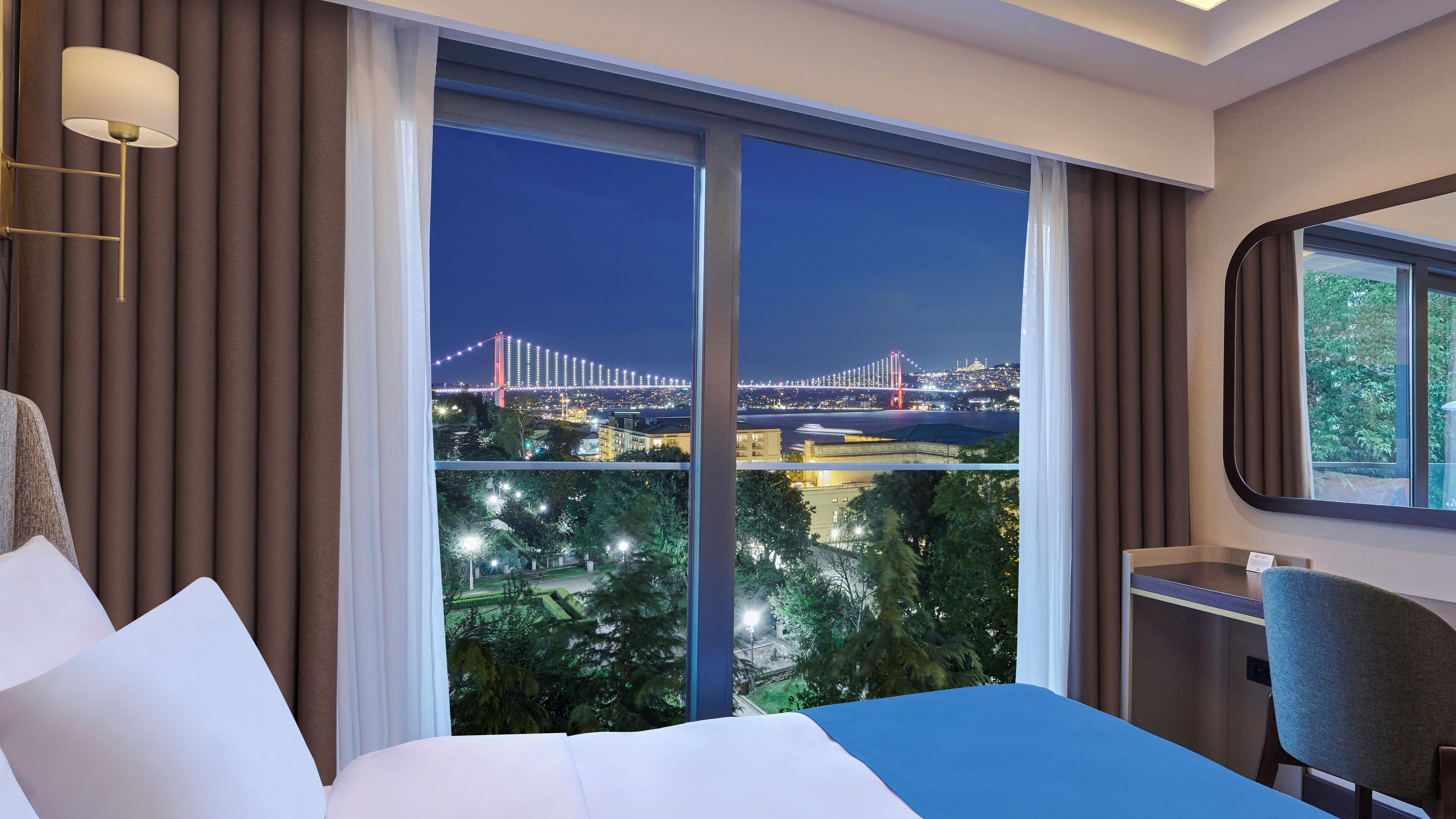 Deluxe Room, Partial Sea View | Minibar, iron/ironing board, free WiFi, bed sheets