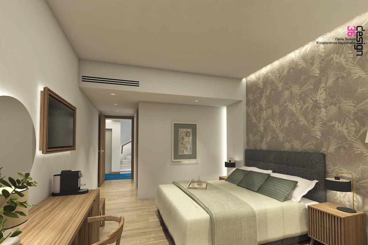 A modern bedroom with a large bed, bedside tables, a desk, and a chair. There is a staircase leading to an upper floor.