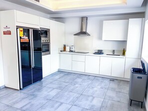 Fridge, microwave, electric kettle, cookware/dishes/utensils