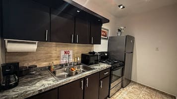 Fridge, microwave, stovetop, coffee/tea maker