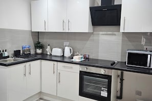 Apartment | Private kitchen | Fridge, microwave, oven, stovetop