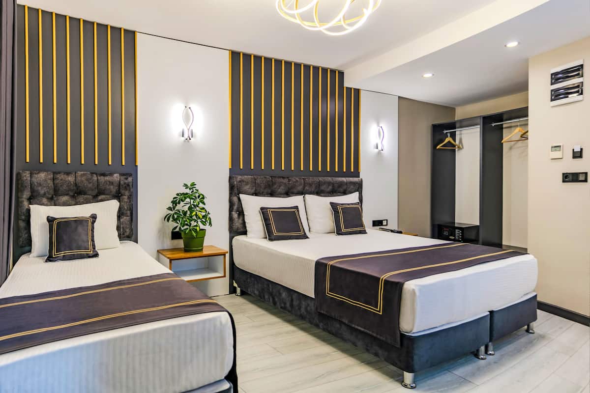 Family Suite, Patio, City View | Minibar, in-room safe, desk, laptop workspace