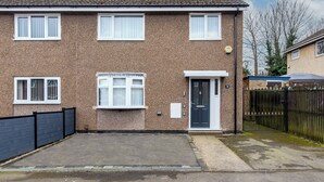 A two-story residential building with a brick exterior, a front door, and a small front yard. - Langdown House (Nottingham)