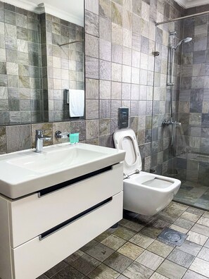 Shower, eco-friendly toiletries, towels, soap