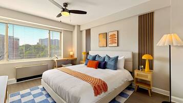 1 bedroom, desk, iron/ironing board, travel crib