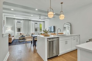 A modern kitchen with white cabinetry, a dishwasher, and pendant lighting. - Luxe Oasis ~2mi to DT• Skyline • Rooftop • Firepit (Nashville)