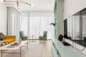 Luxury Apartment, City View | Living area | 52-inch flat-screen TV with cable channels