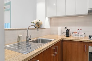 Luxury Apartment, City View | Private kitchen | Espresso maker, coffee/tea maker, electric kettle, paper towels