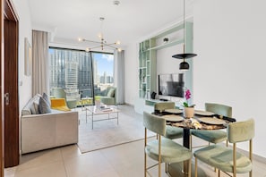 Luxury Apartment, City View | Living area | 52-inch flat-screen TV with cable channels